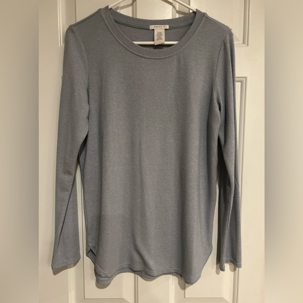 Matty M soft thin blue long-sleeve top. Flattering side curve slit. Med